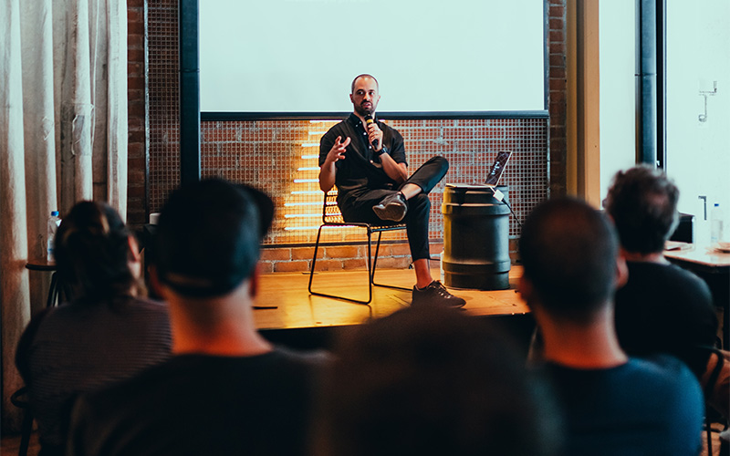 photo - a speaker on stage in front of an audience