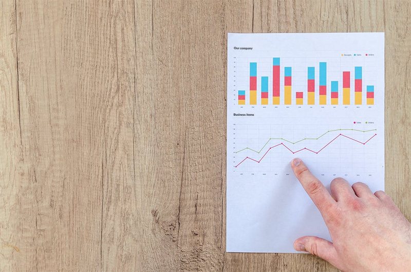 photo - closeup of someone reviewing a data chart