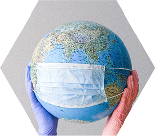 photo - gloved hands hold up a globe with a mask fitted to it